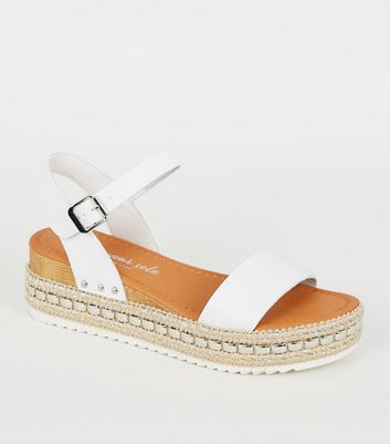 white studded flatforms