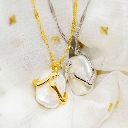 Two Hands Hugging White Stone...