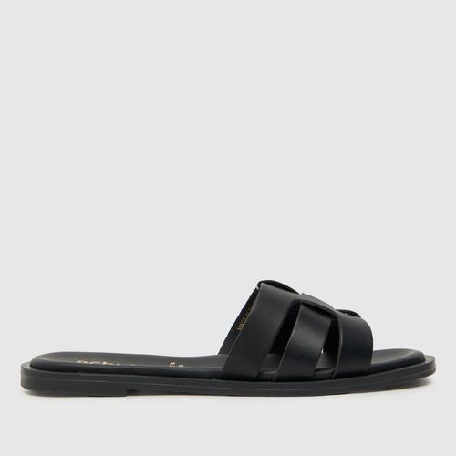 schuh taye slider sandals in black