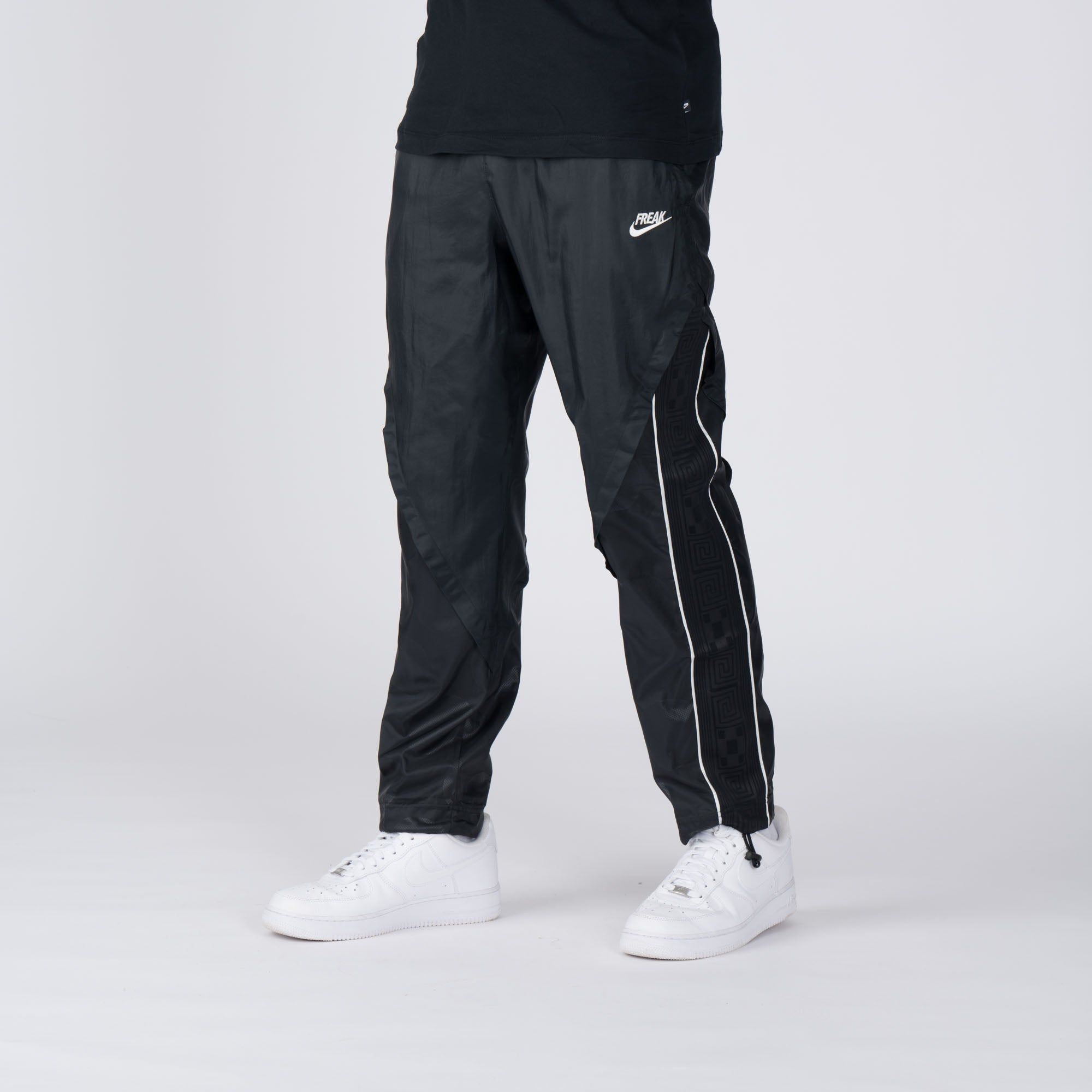 Nike track pants foot clearance locker