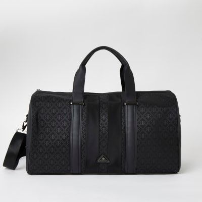 Mens River Island Black RIR monogram holdall bag Compare Cabot