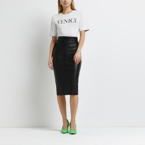 Girls black faux leather pleated skirt