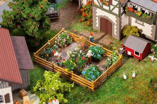 Ziergarten mit Blumen und...