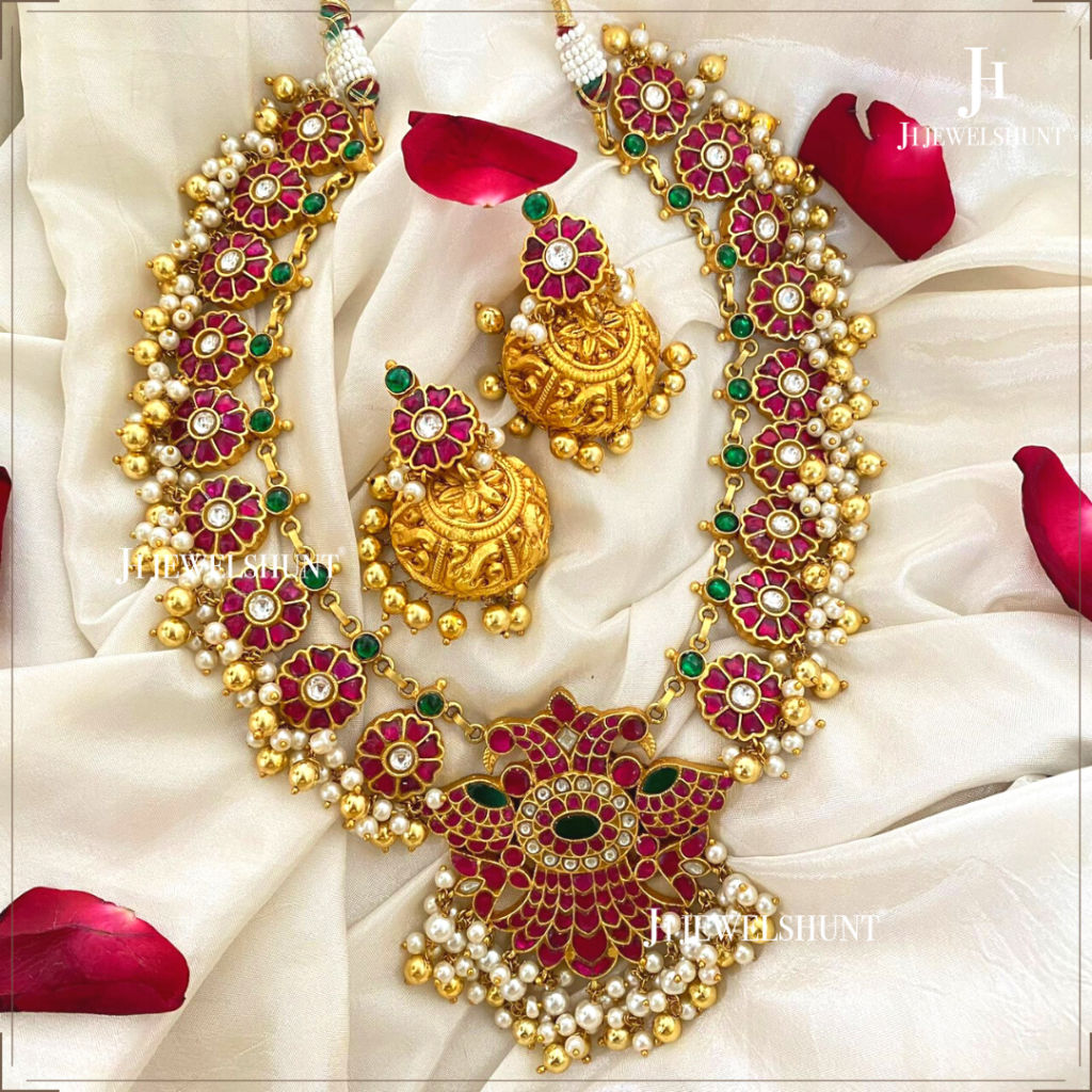 Kundan jadau eagle pendant flowers necklace with flowers studs with nakashi jhumkas