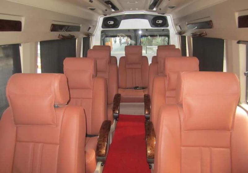 Interior of a 9-seater Tempo Traveller with Maharajah seats