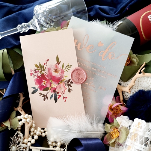 A blush pocketfolder invitation paired with a rose gold UV printed wedding invitation. A blush pocketfolder invitation paired with a rose gold UV printed wedding invitation.