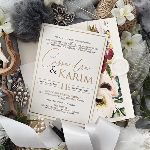 Cassandra & Karim created a gold foil stamped wedding invite with a floral lined envelope. Cassandra & Karim created a gold foil stamped wedding invite with a floral lined envelope.