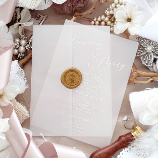 Lauren & Percy chose a vellum insert with a vellum jacket with a gold wax seal.