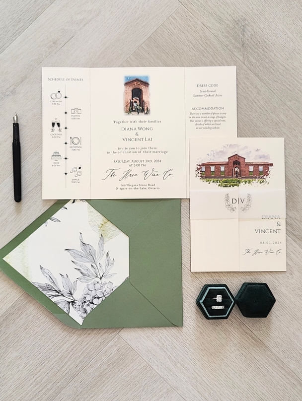 Gatefold Wedding Invitation with a vellum belly band and a green envelope with envelope liner