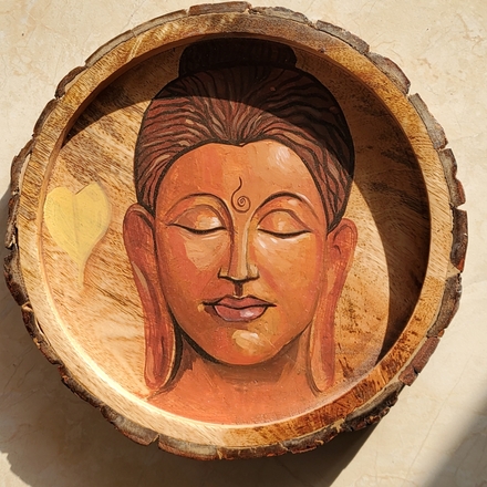 Buddha on a circular tray