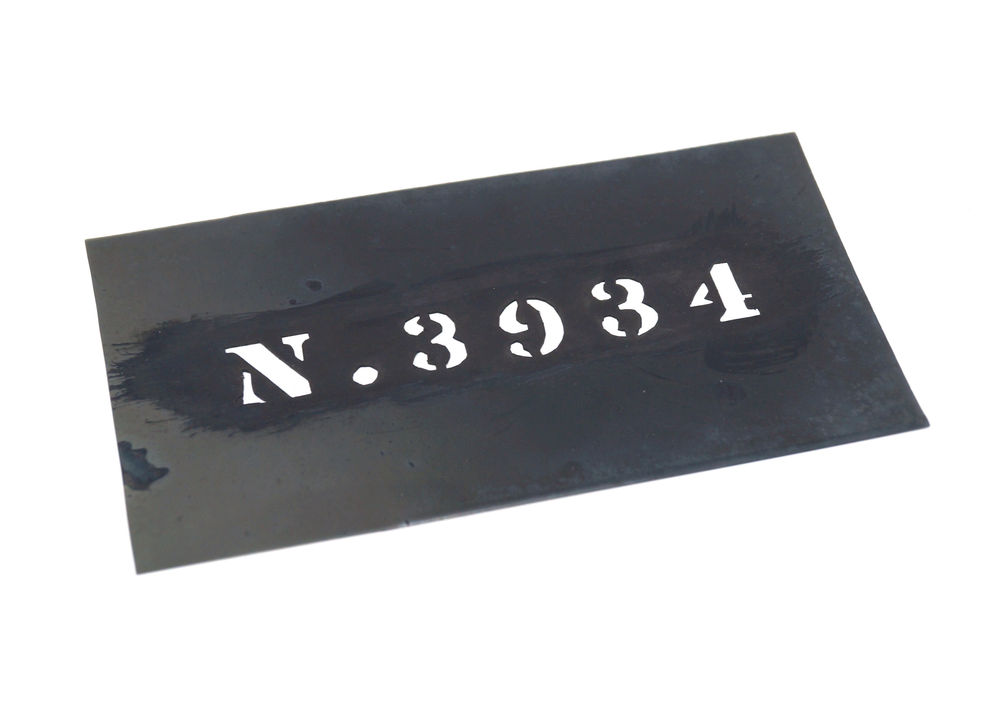 Photograph of a laundry number stencil