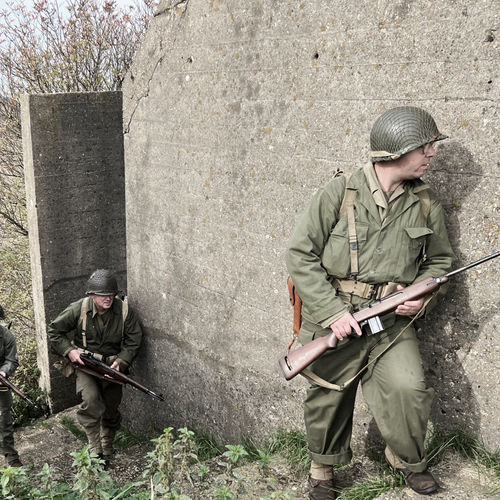 A rifle squad prepares to clear one of the three blockhouses in the area, in readiness for the Company CP to be established. 