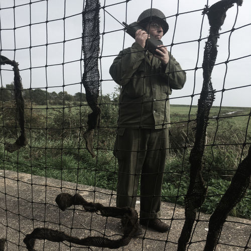 A member of the Headquarters Company contacts nearby units using the BC-611 "Handie-Talkie" radio. 