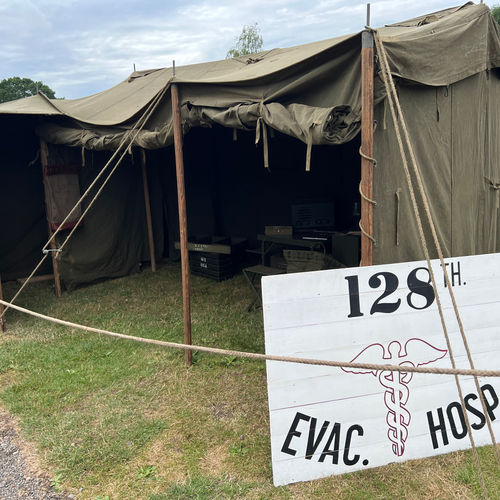 The M1942 Command Post Tent acted as the clerk's office for our display. The wooden sign was carefully recreated from a photograph of an original in use at the 128th Evacuation Hospital.