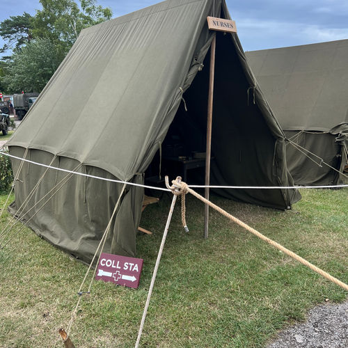 Demonstration of a Nurse's Quarters, housed in a Small Wall Tent and complete with a US Army Special Services phonograph, folding cot and various personal items.