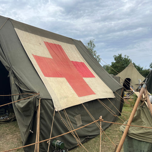 Exterior view of the Operating Room, which was housed in a Large Wall Tent complete with Generva Convention red cross flysheet.