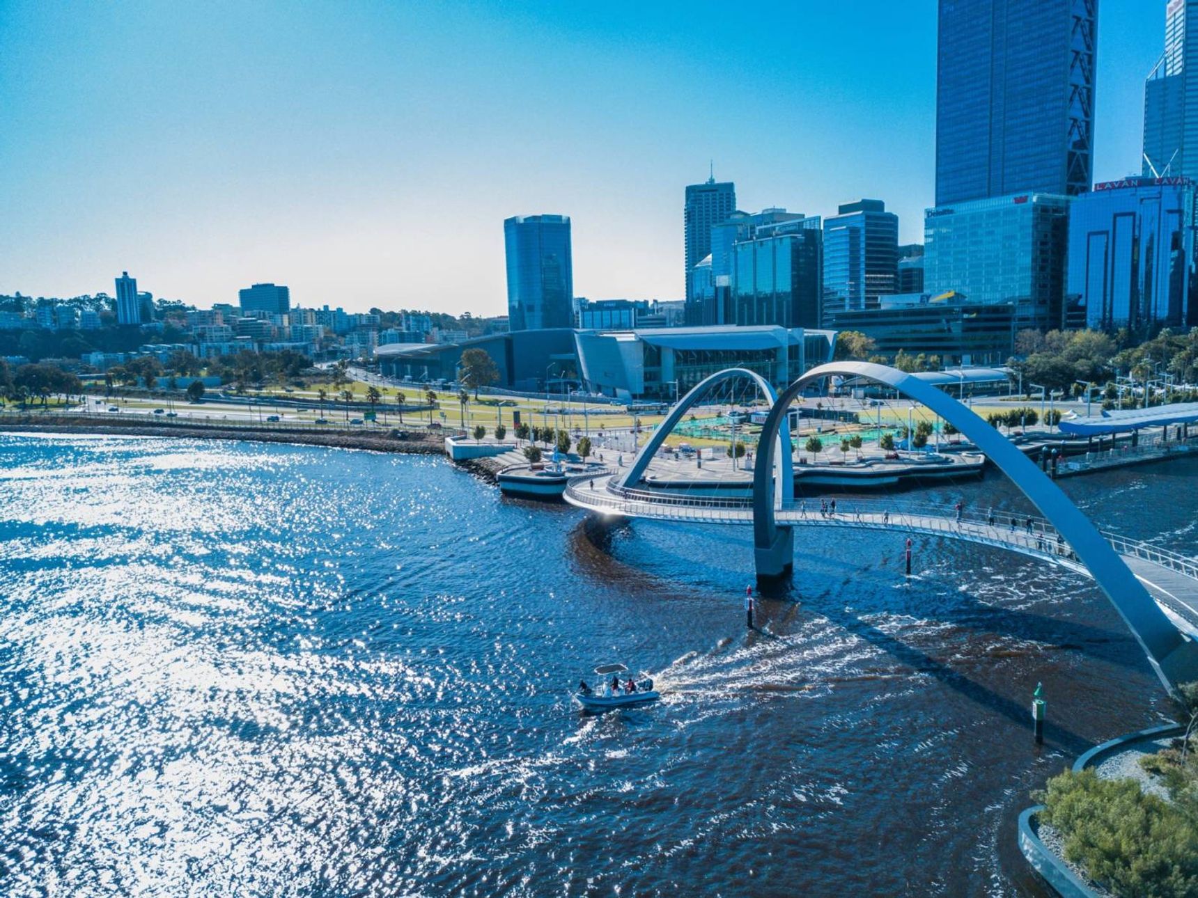 aerial photography of bridge over river near high-rise building
