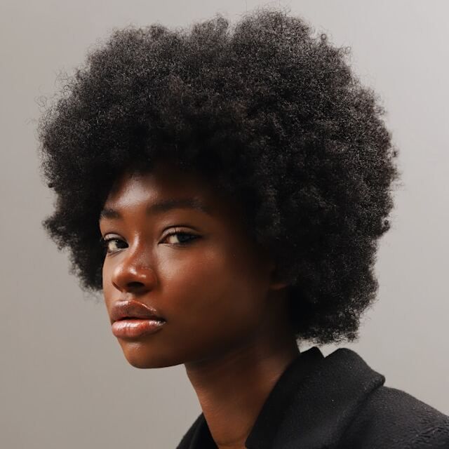 Profile shot of a black girl with afro