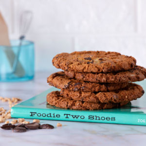 Zoe's Crush Cookie stacked on a cook book