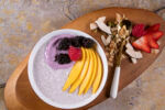 View 3668 Scoopables Chia Pudding Bowl MangoOverheadBrownBackground1