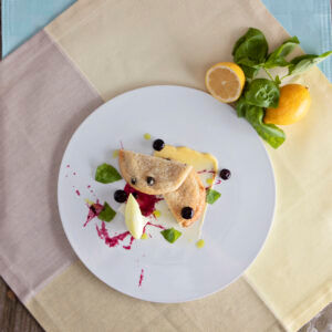 Lemon Blueberry Cookie Plated with berries and berry sauce Lemon Blueberry Cookie Plated with berries and berry sauce
