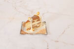 View Salted Caramel Vanilla Crunch Cake Plating