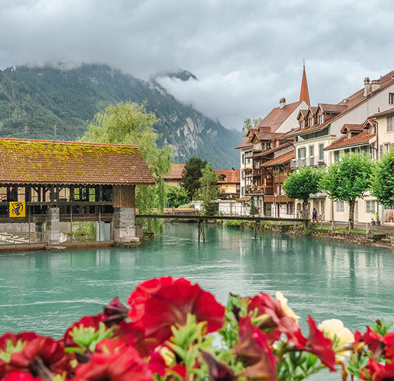 Night skyline of Interlaken with Jet d'Eau fountain