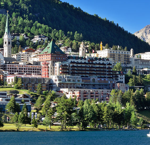 Interlaken riverside houses and mountains in Bernese Oberland