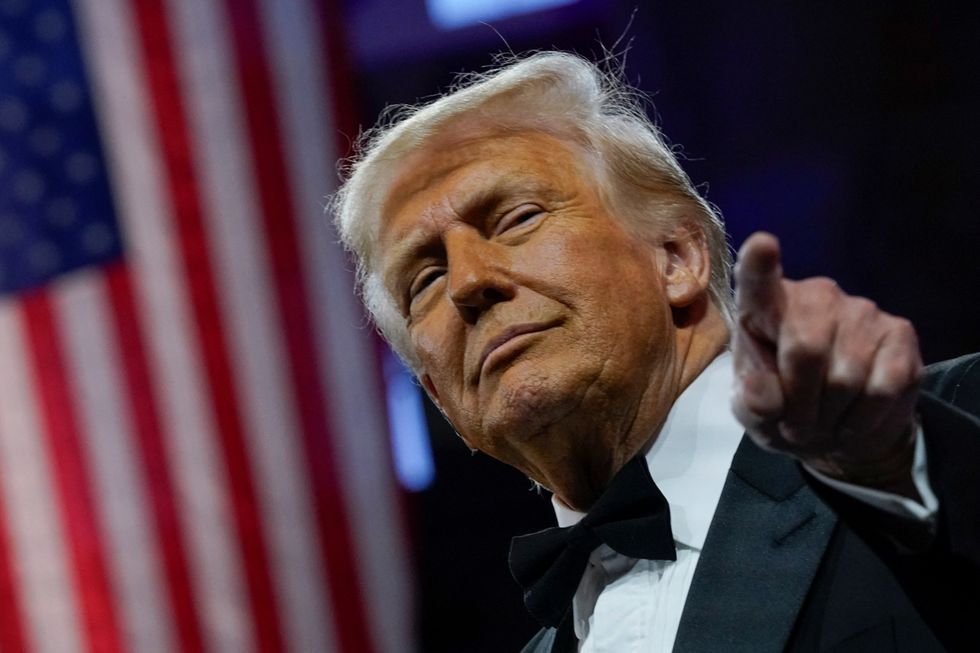 u s president donald trump gestures as he attends the national republican congressional committee nrcc dinner at the national