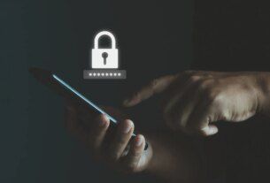 Man holding phone with password security lock icon