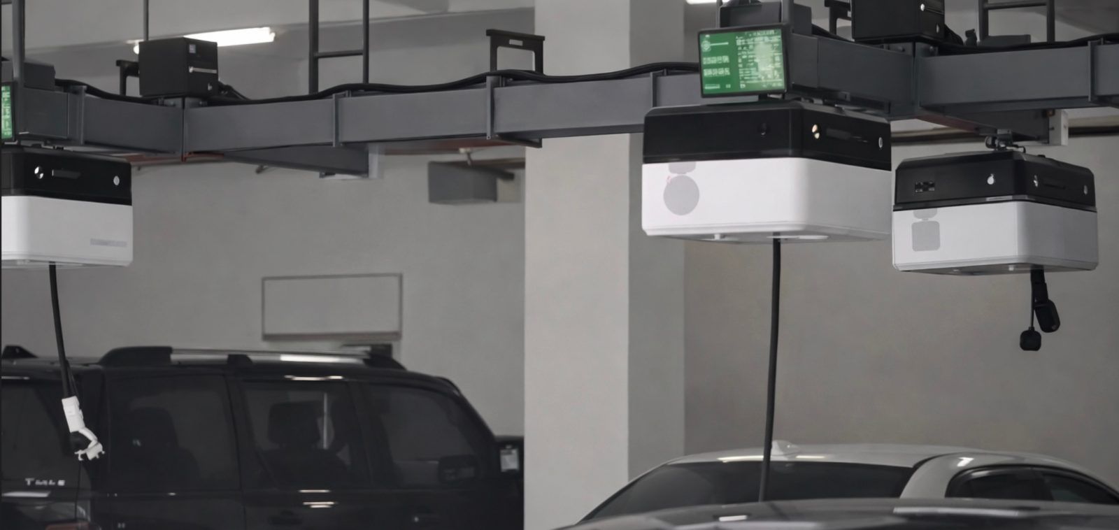 These Chinese robots ride ceiling rails to charge your EV