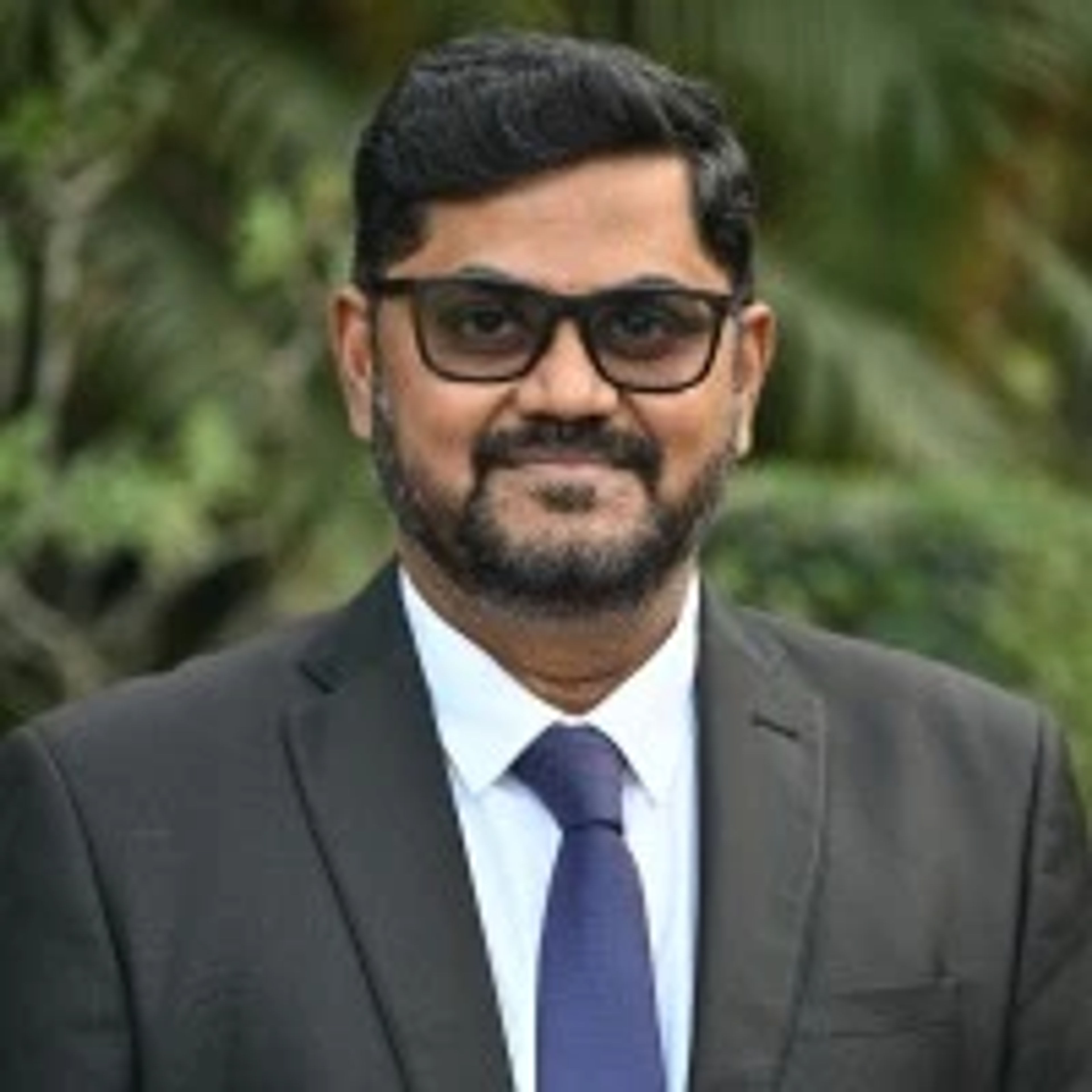 Dr. Samik Shome