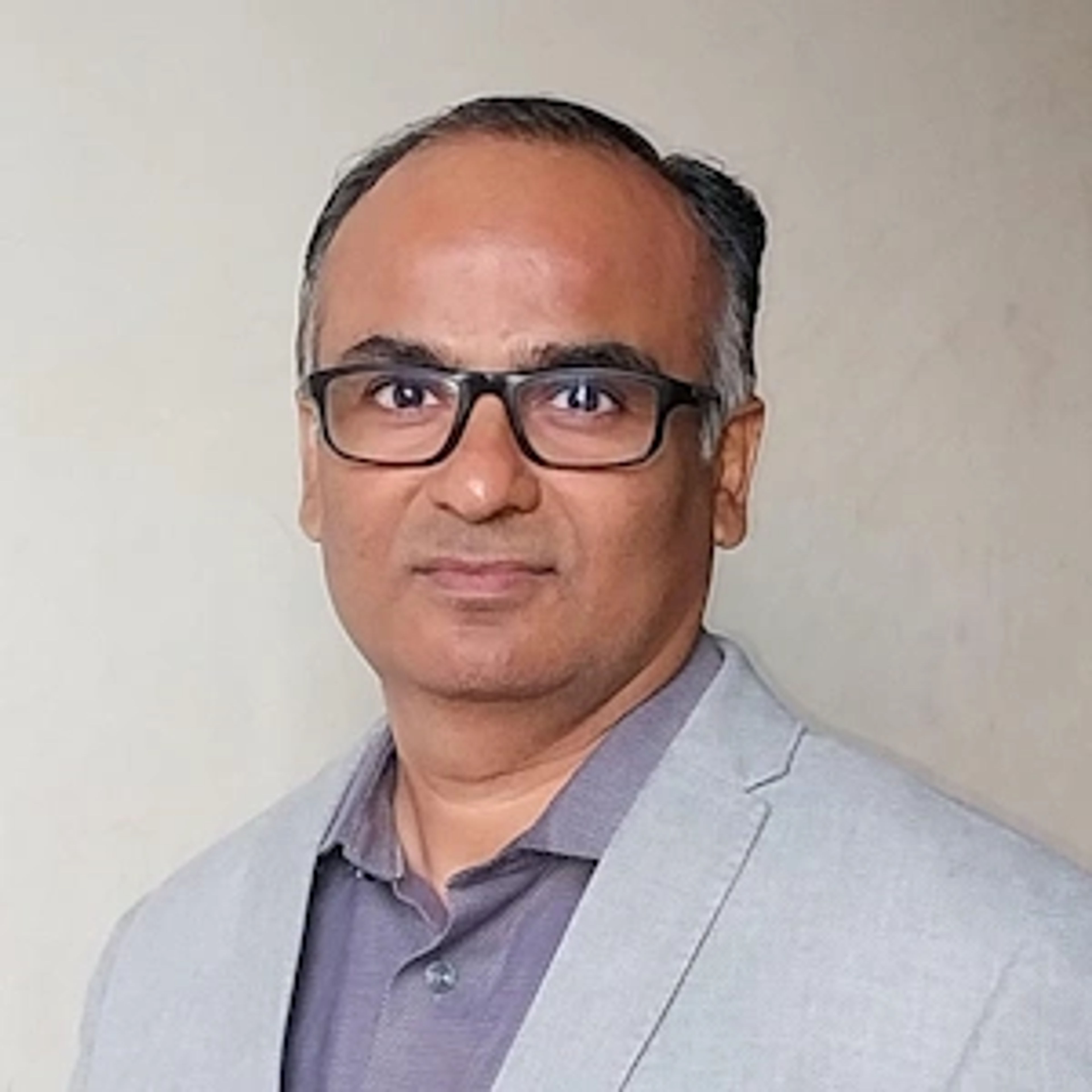 Dr. Dharmesh Raval