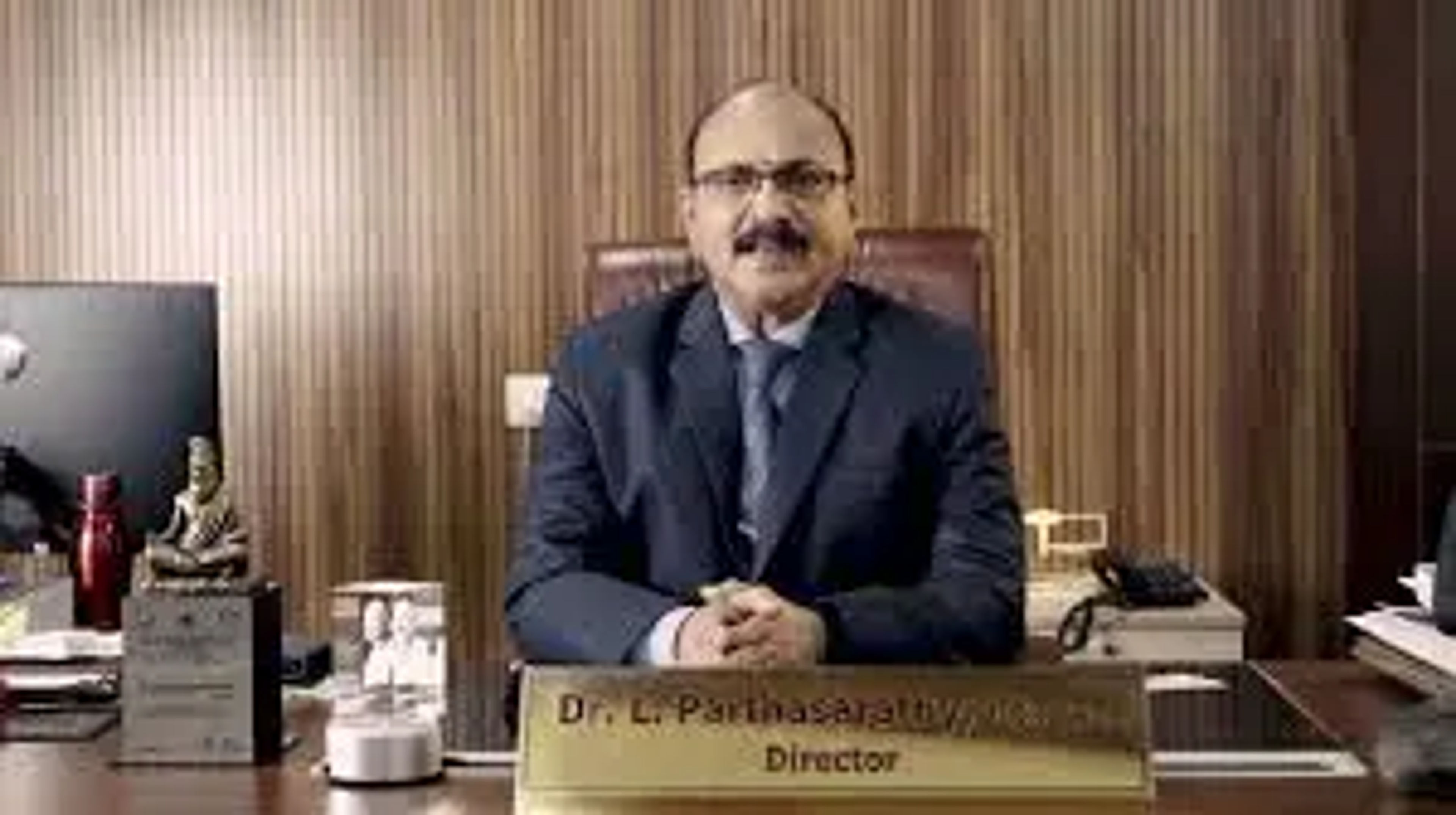 Dr. L. Parthasarathy —