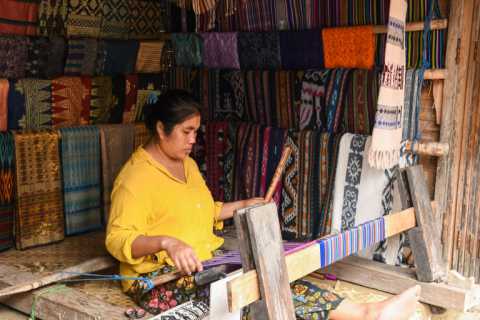 sasak-woman-traditionally-makes-yarn-with-spindle-wheel-traditional-sasak-village-lombok.webp