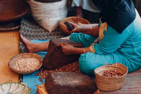 woman-making-argan-oil-by-hand-craft.webp