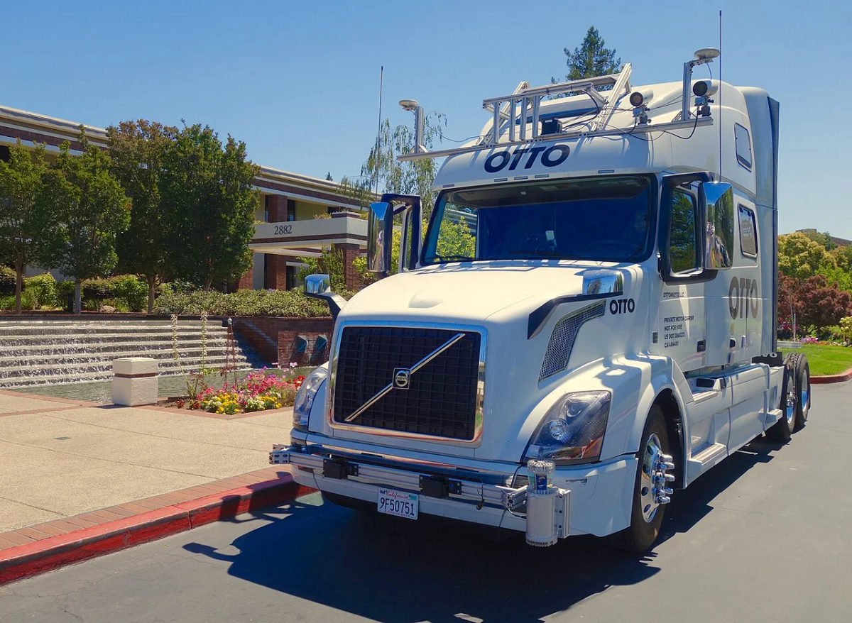 An Uber and OTTO autonomous-driving truck on a road.