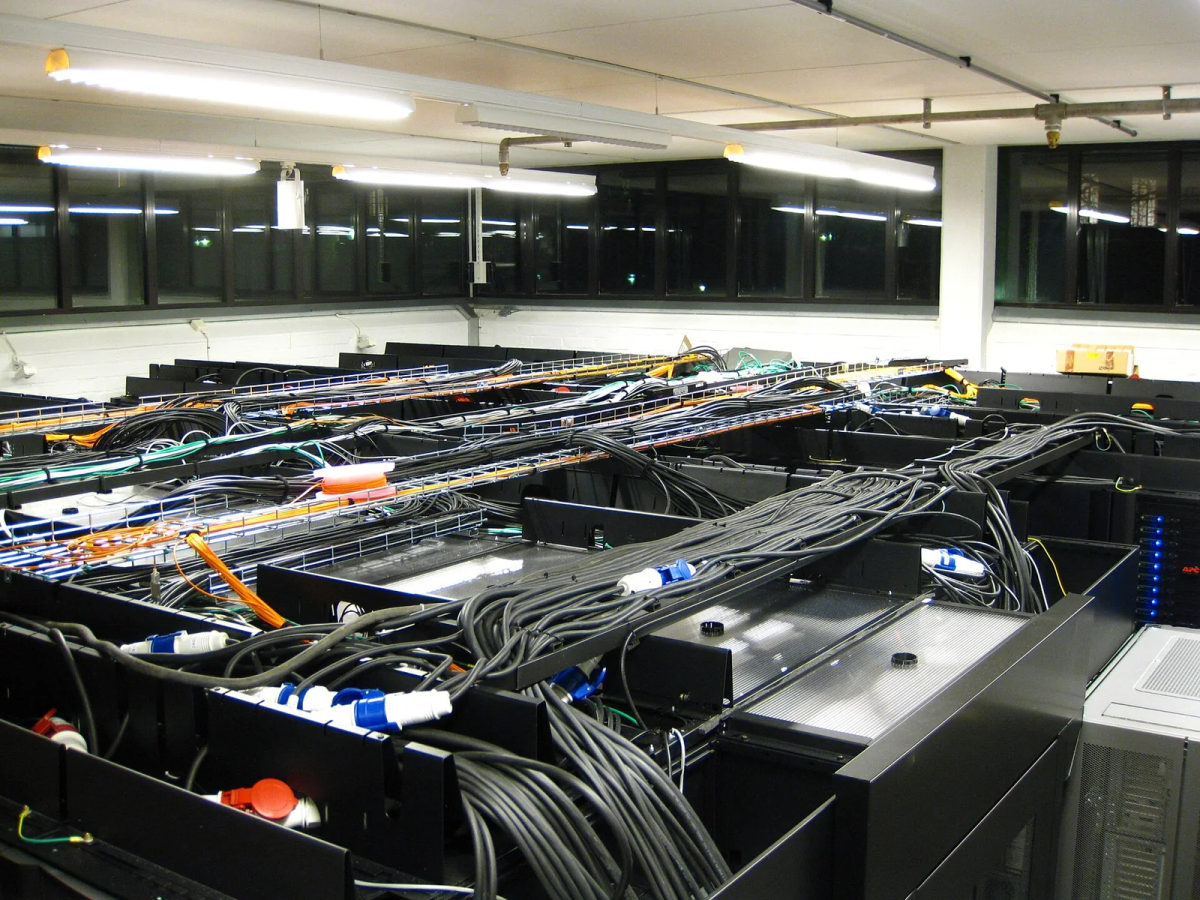 Rows of rack-mounted servers and network equipment in a computer room.