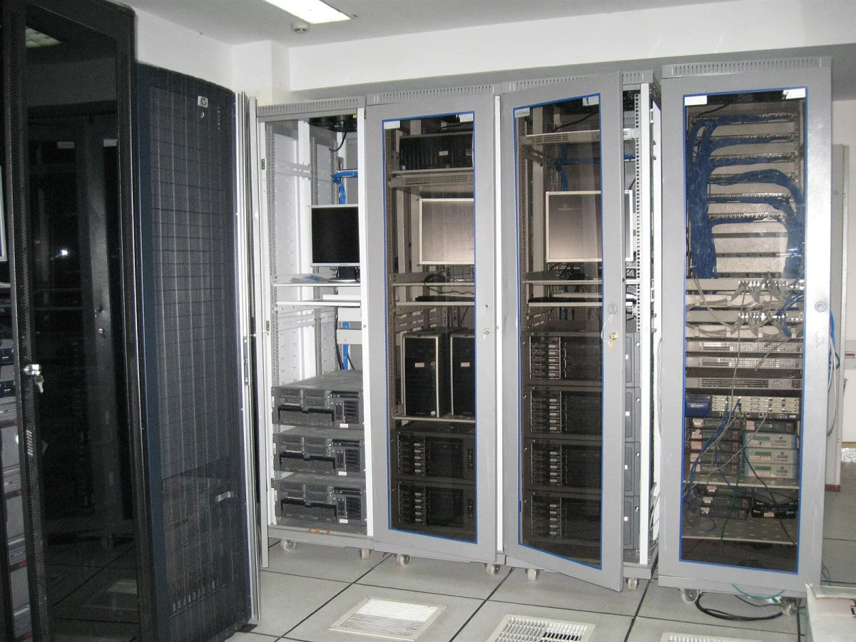 Rows of rack-mounted servers and network equipment in a computer room.