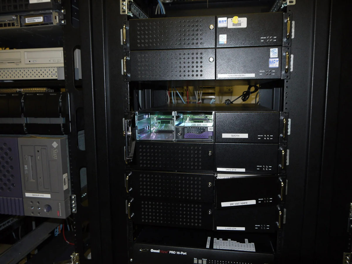 Rows of rack-mounted servers and network equipment in a computer room.