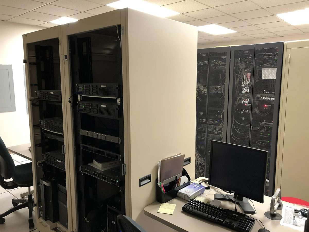 Rows of rack-mounted servers and network equipment in a computer room.