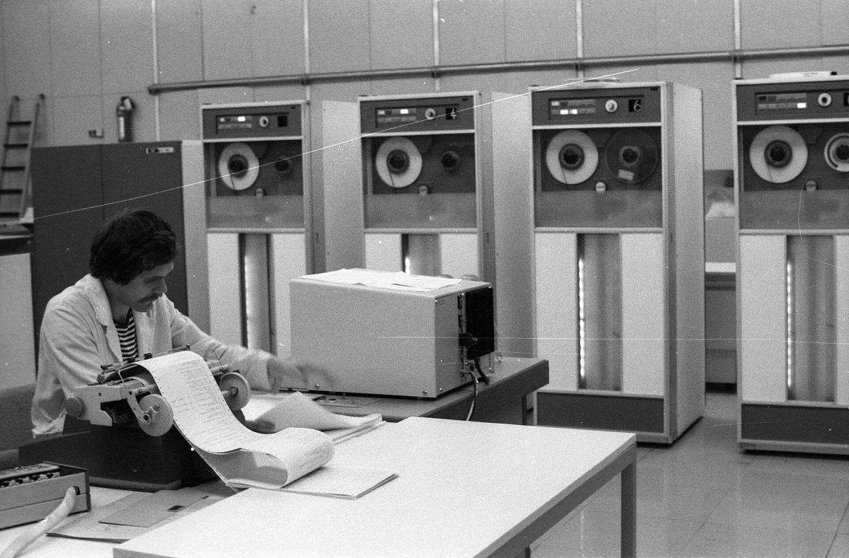 Rows of rack-mounted servers and network equipment in a computer room.