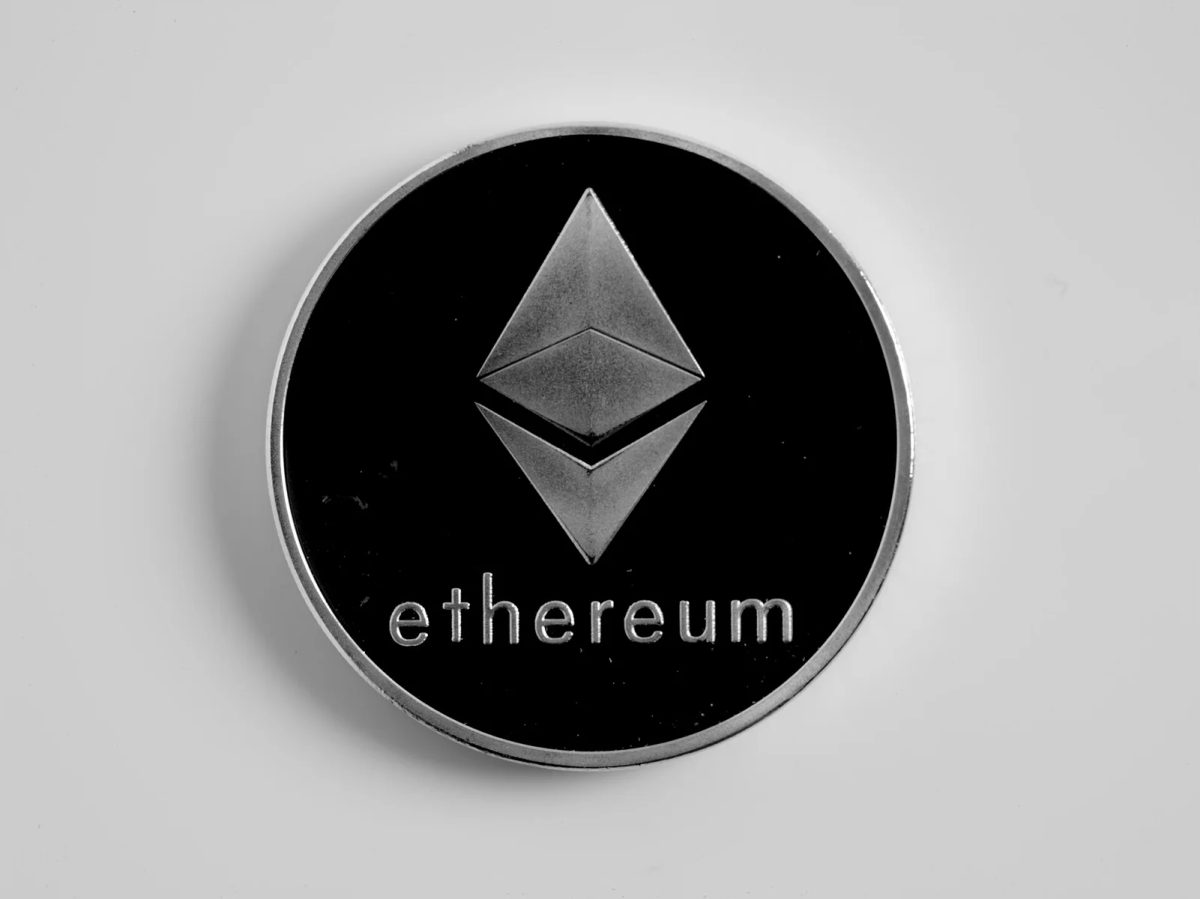 A physical Ethereum token photographed close up.