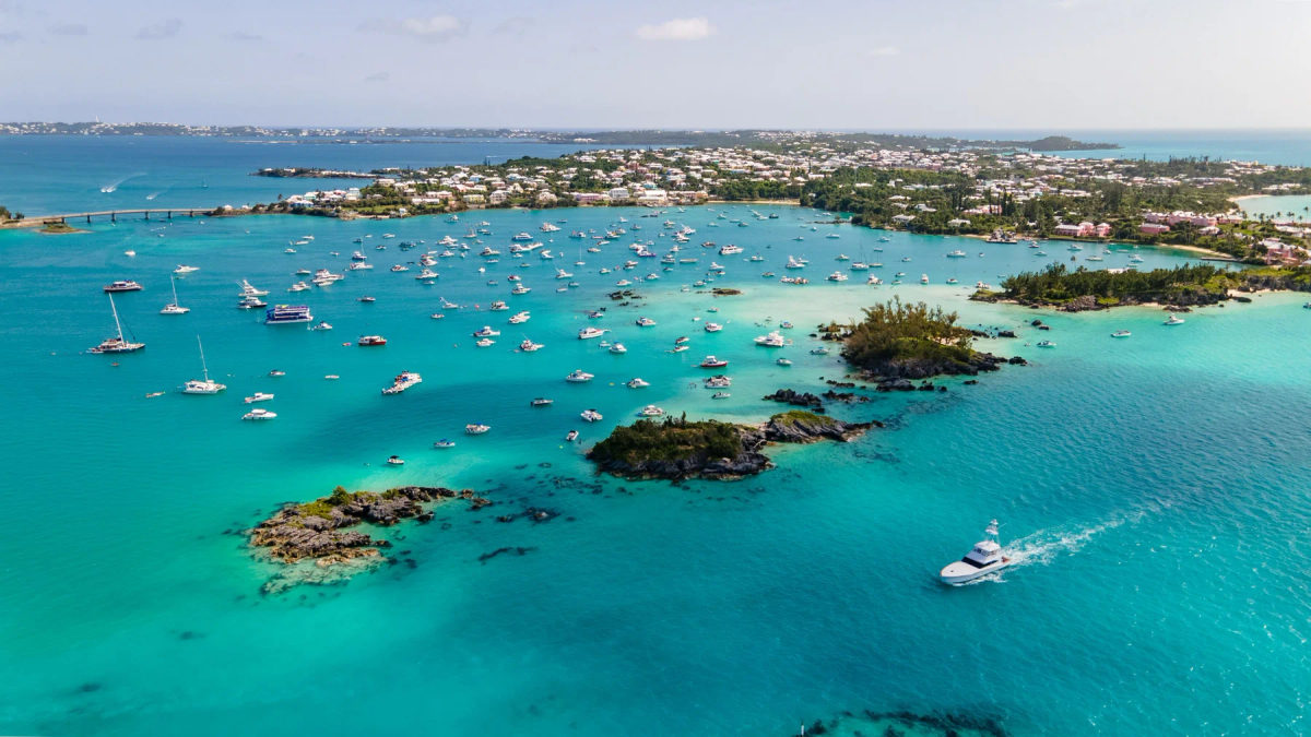 Aerial view of Bermuda harbor with boats and turquoise water.
