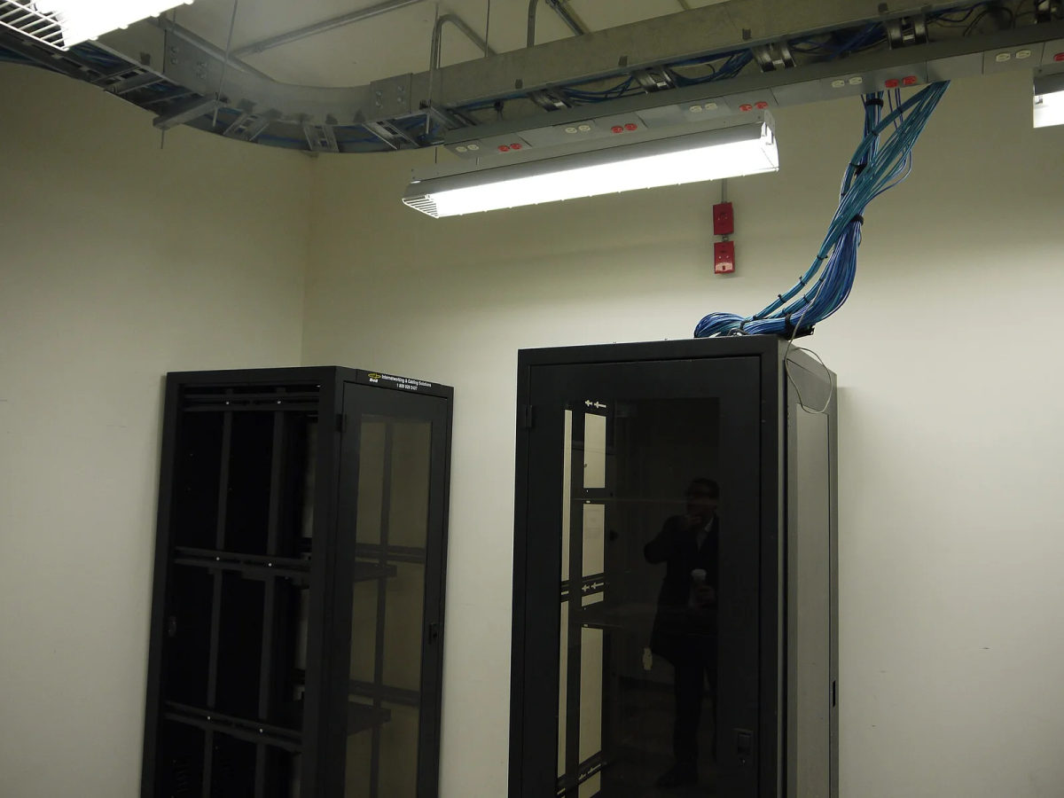 Rows of rack-mounted servers and network equipment in a computer room.