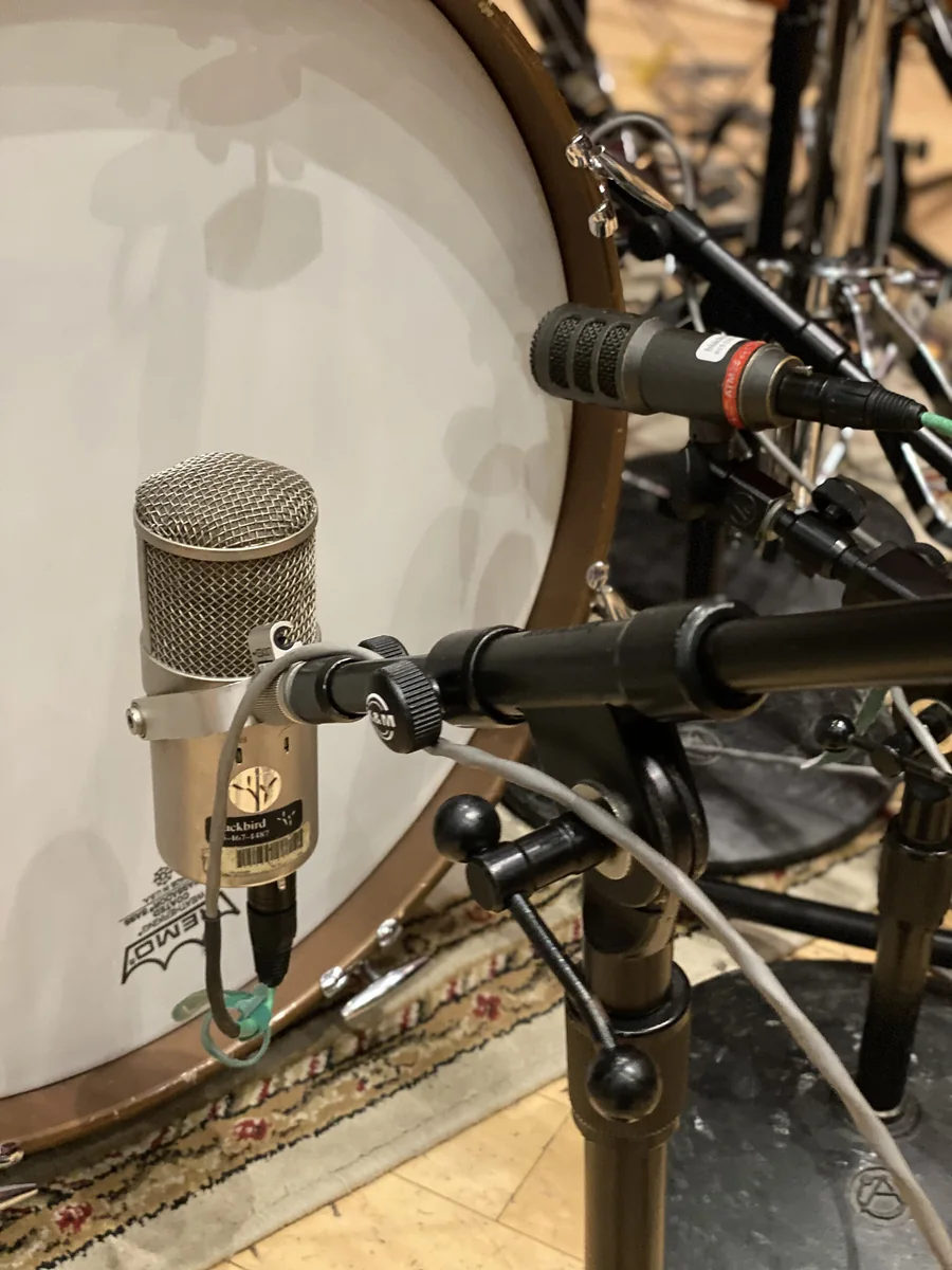 Microphones and recording equipment in a studio.