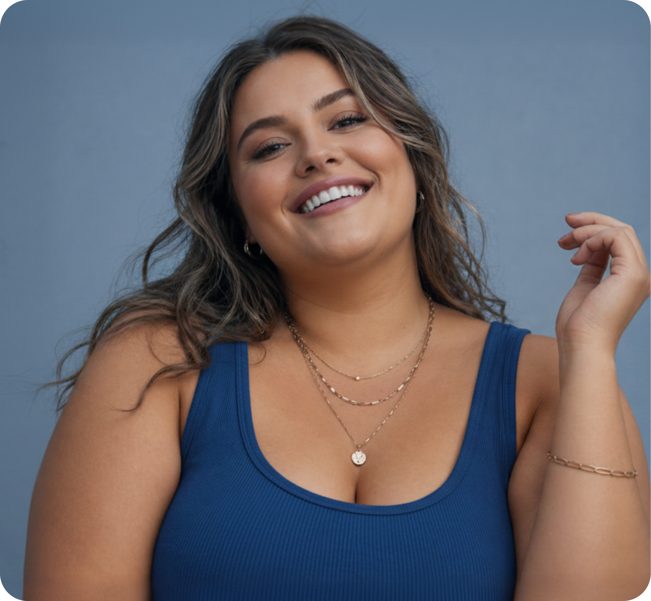 A Trinity Meds member confidently flexing after her weight-loss journey