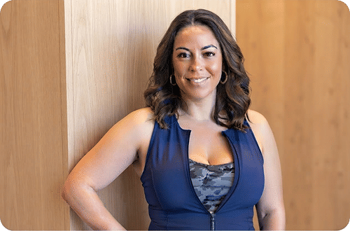 Woman flexing, feeling strong and energetic