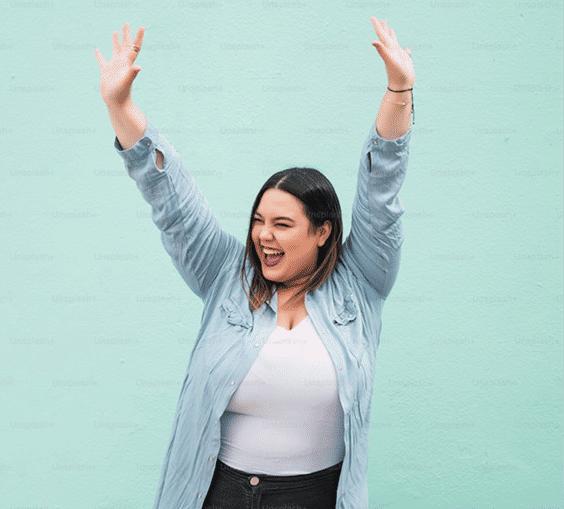 A Newmemeds member laughing after her weight-loss journey