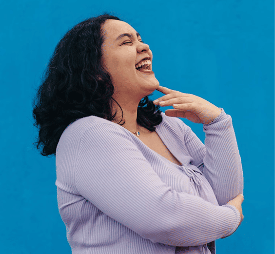 A Theirsrx member laughing after her weight-loss journey